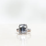 Solitaire Ring with White Topaz and Diamond Halo in White Gold